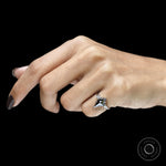 Platinum black moissanite ring with unique cluster design and mixed cut gemstone accents