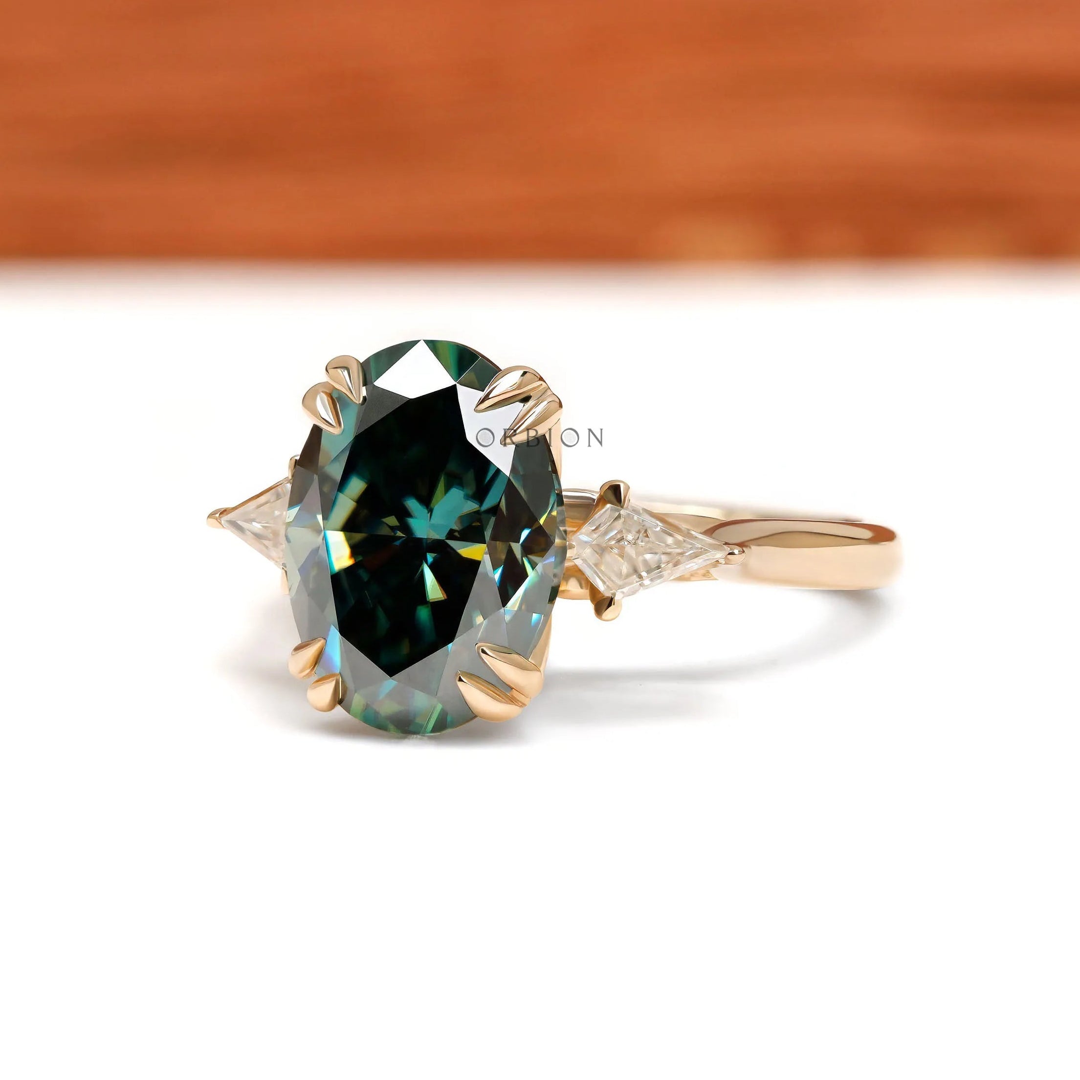 Oval blue green moissanite engagement ring with floral bridge in 14k yellow gold