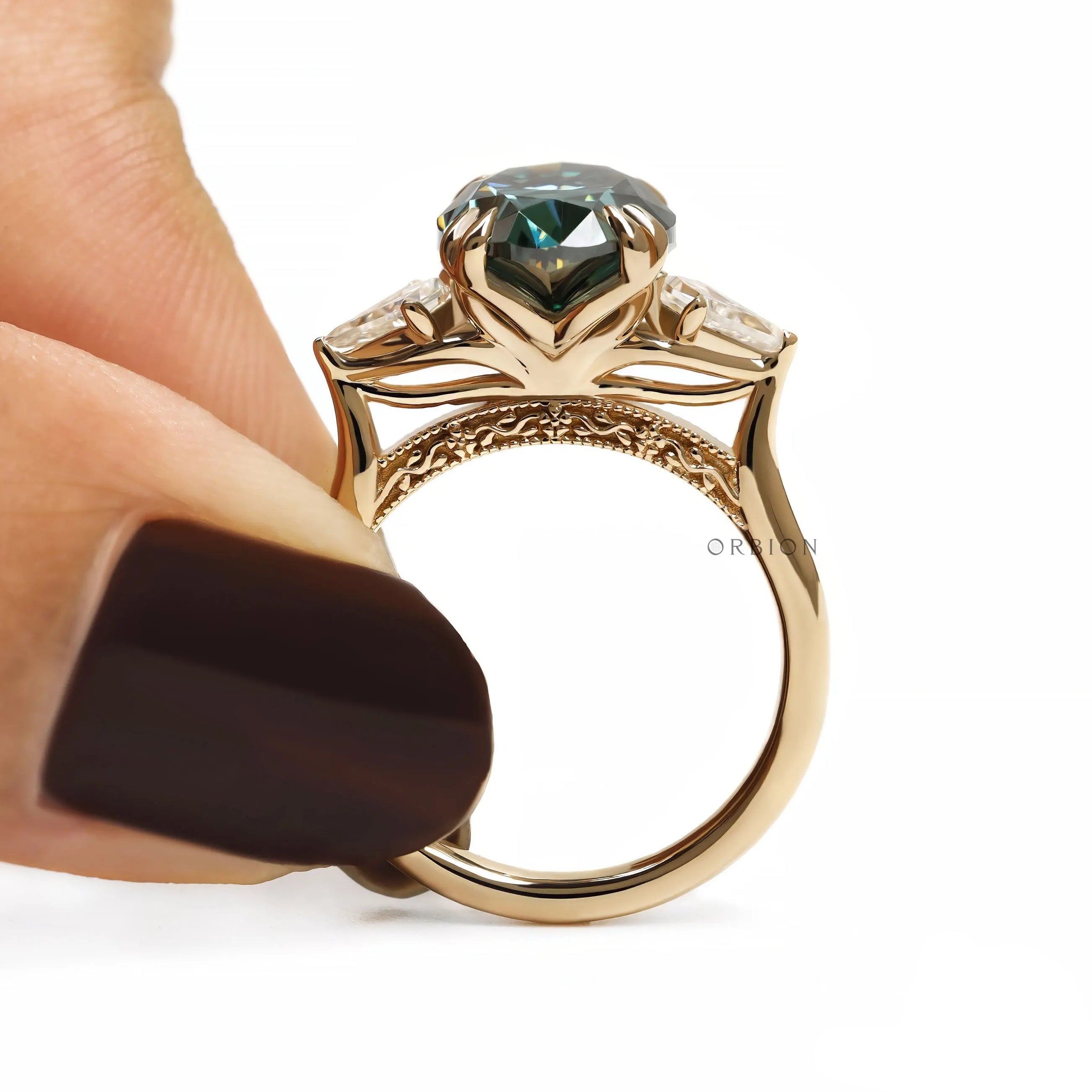 Modern cathedral engagement ring with oval blue green moissanite, kite accents and floral bridge 