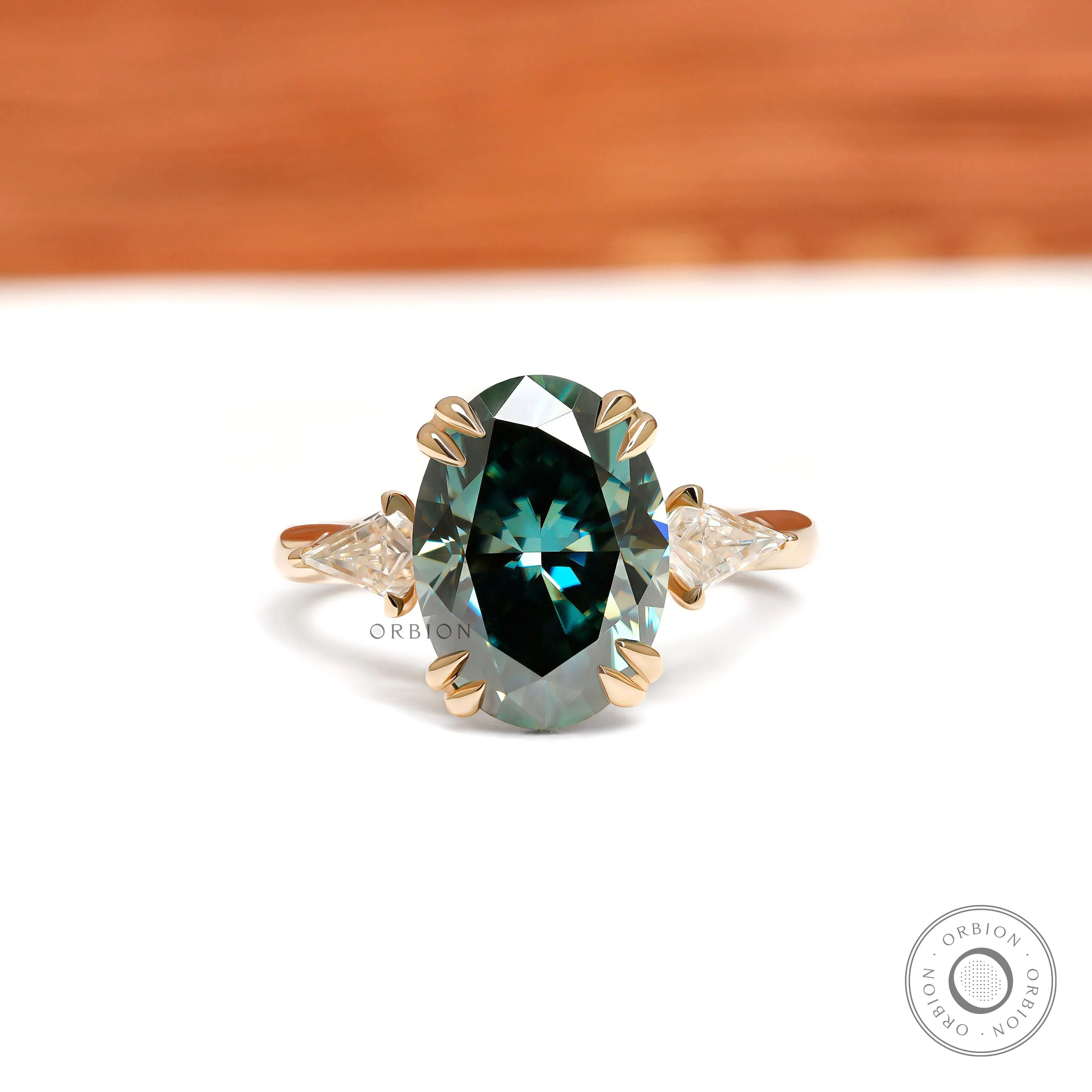 Oval blue green moissanite three stone cathedral engagement ring with kite accents 14k yellow gold 