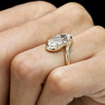 Engagement ring with old mine cut moval lab diamond in a vintage inspired bypass yellow gold setting