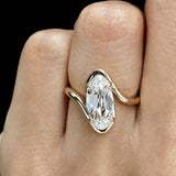 Vintage inspired lab grown diamond bypass ring featuring moval old mine cut stone