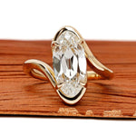 Antique moval lab grown diamond bypass engagement ring with old mine cut and swirl band in 14k yellow gold