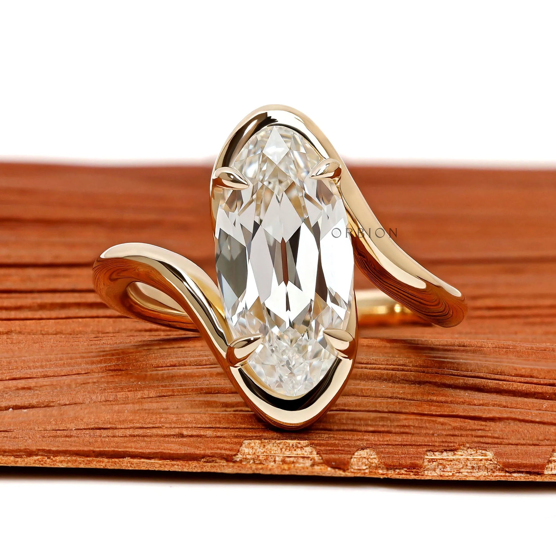 Antique moval lab grown diamond bypass engagement ring with old mine cut and swirl band in 14k yellow gold