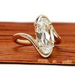 14k yellow gold bypass ring featuring antique moval lab diamond with old mine cut vintage design