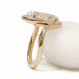Old mine cut moval lab diamond bypass engagement ring crafted in 14k yellow gold with artistic swirl shank