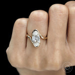 Vintage inspired lab grown diamond bypass ring featuring moval old mine cut stone