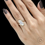 Engagement ring with old mine cut moval lab diamond in a vintage inspired bypass yellow gold setting