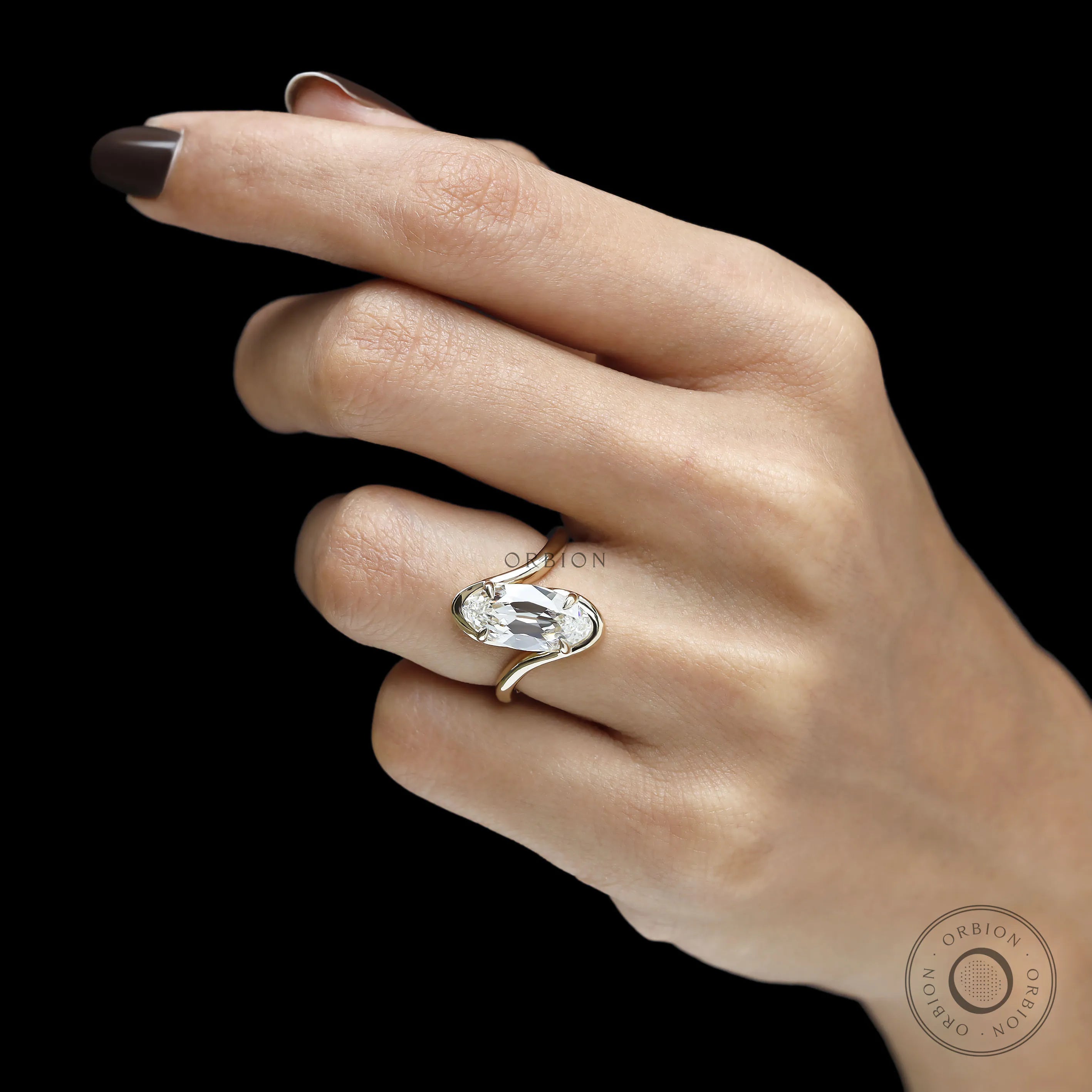 14k yellow gold vintage engagement ring with moval shaped lab diamond, old mine cut and flowing swirl design