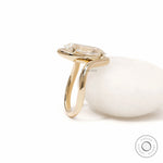 Old mine cut moval lab diamond bypass engagement ring crafted in 14k yellow gold with artistic swirl shank