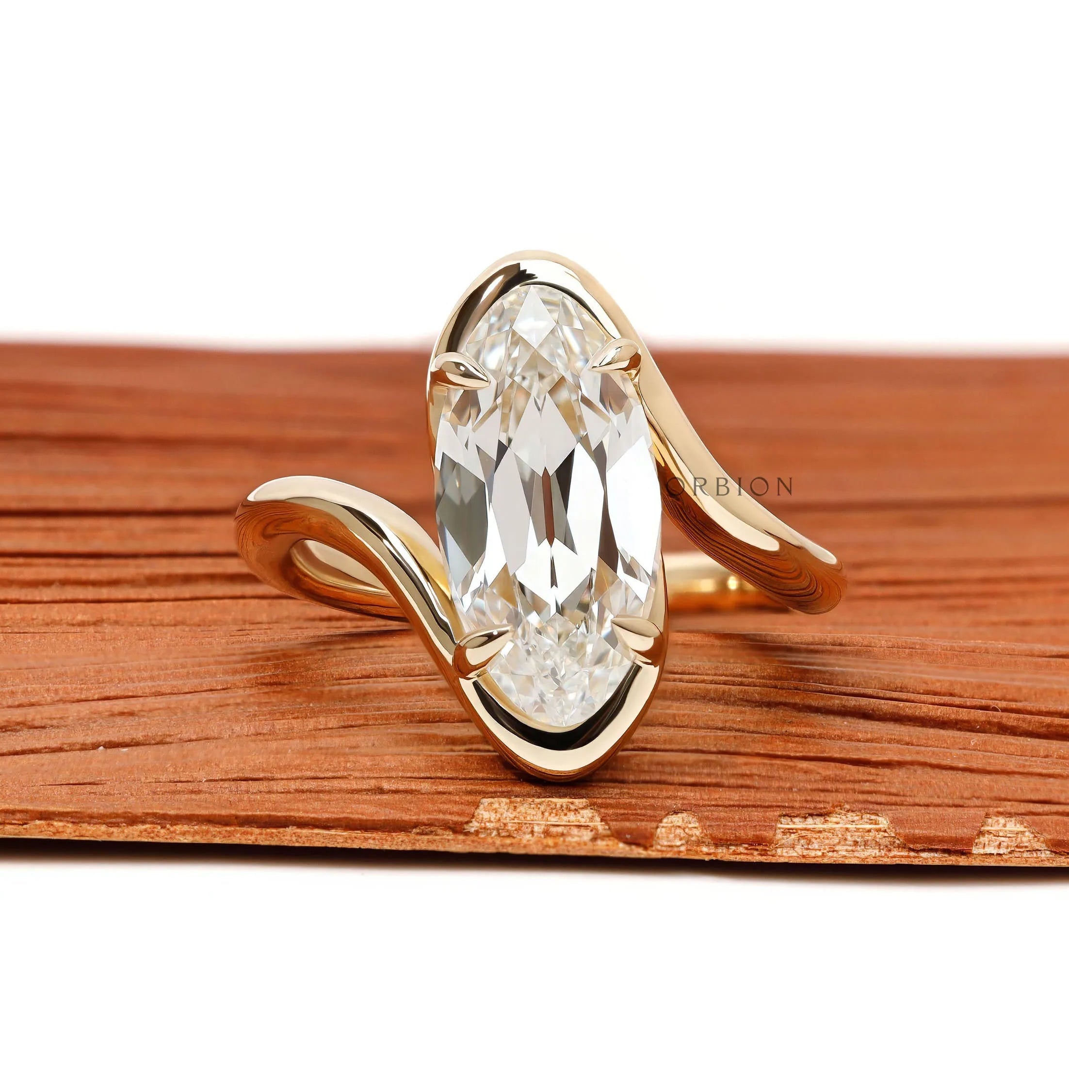 Antique moval lab grown diamond bypass engagement ring with old mine cut and swirl band in 14k yellow gold