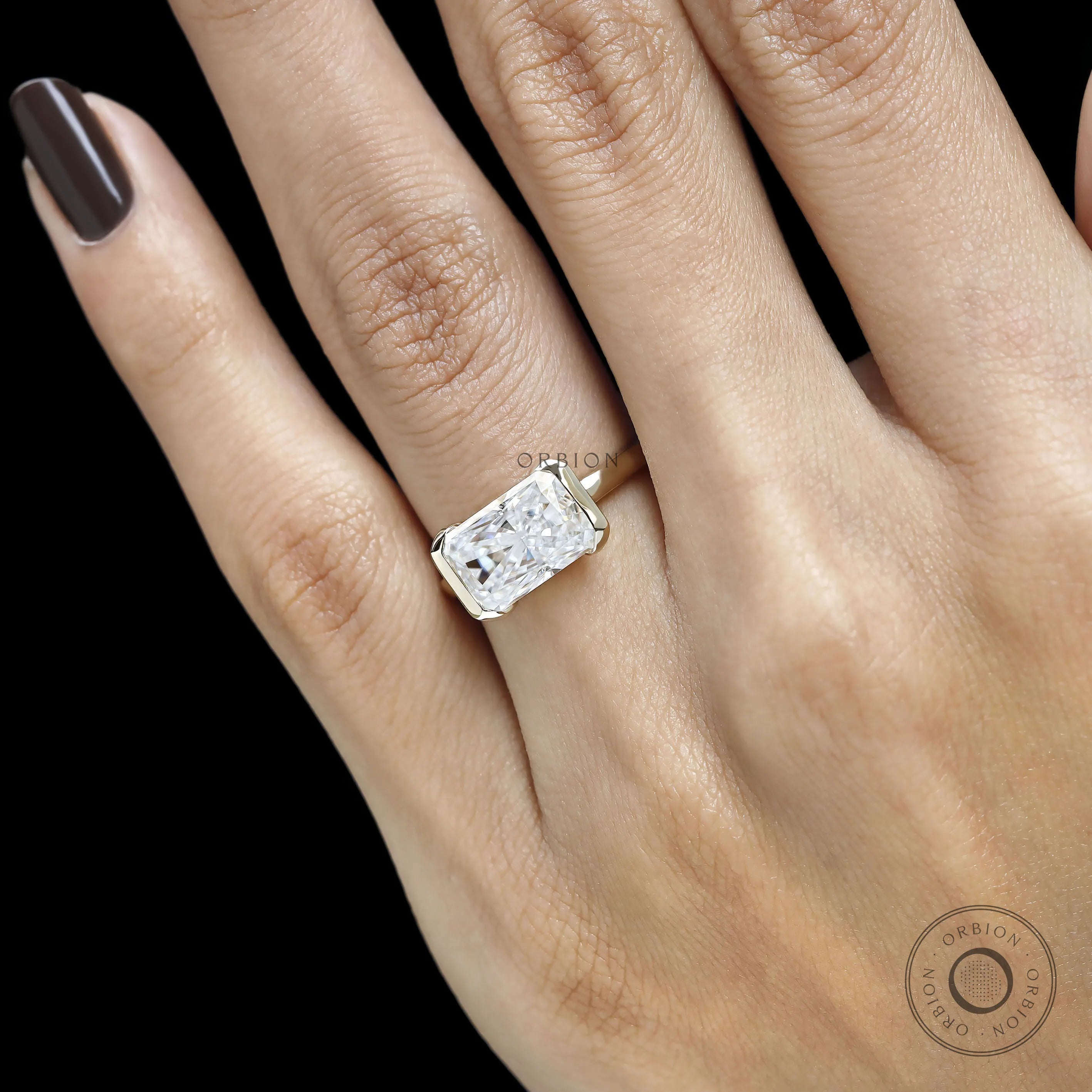 Floating half bezel engagement ring with radiant cut moissanite or lab grown diamond crafted in 14k yellow gold