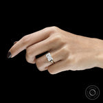 Yellow gold engagement ring with horizontal radiant cut stone and modern floating bezel setting