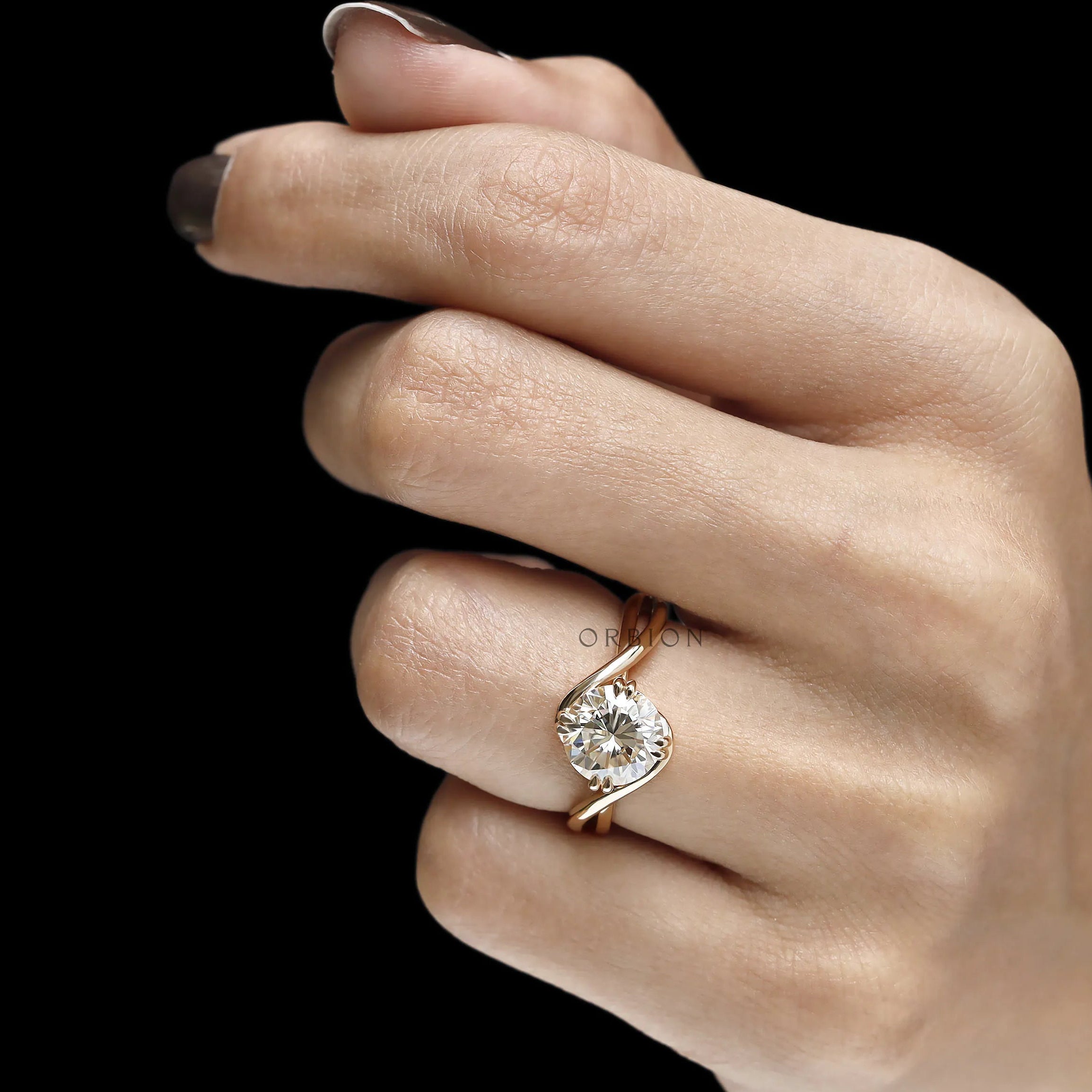 Crossover bypass solitaire ring with moissanite center stone and 14k gold setting
