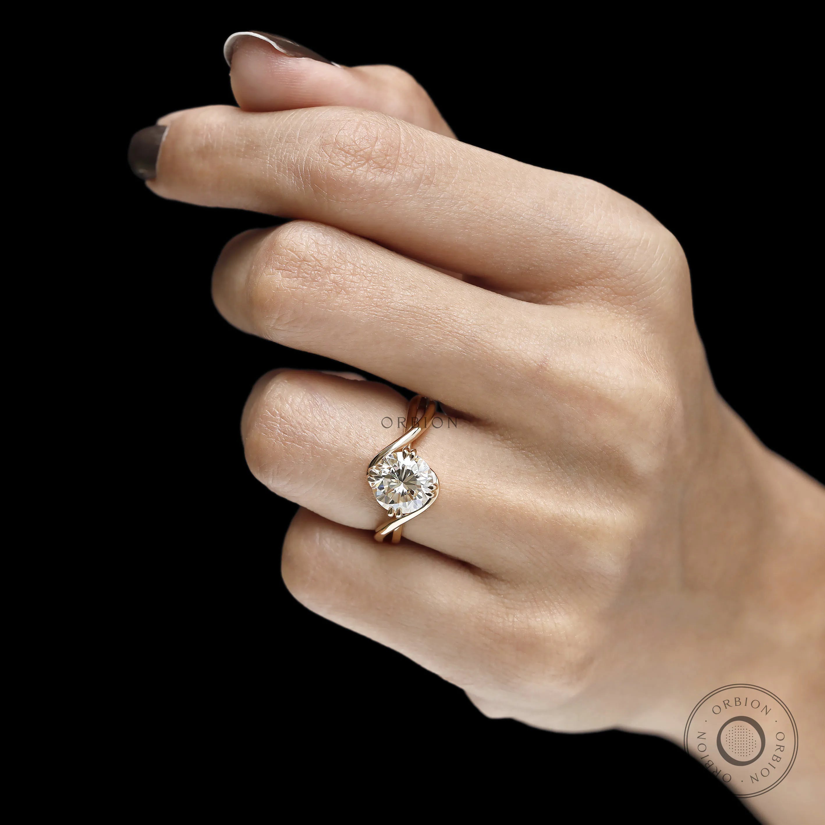 Crossover bypass solitaire ring with moissanite center stone and 14k gold setting