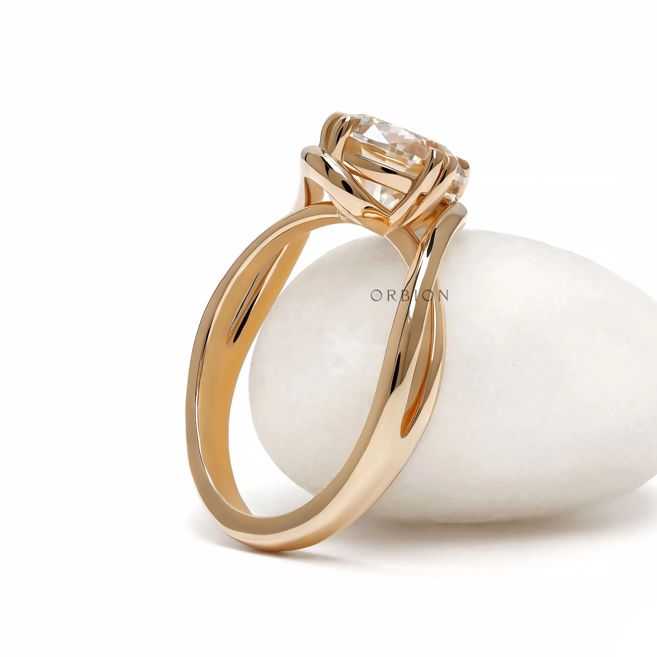 Modern crossover moissanite or lab diamond engagement ring in yellow gold with swirl solitaire setting 