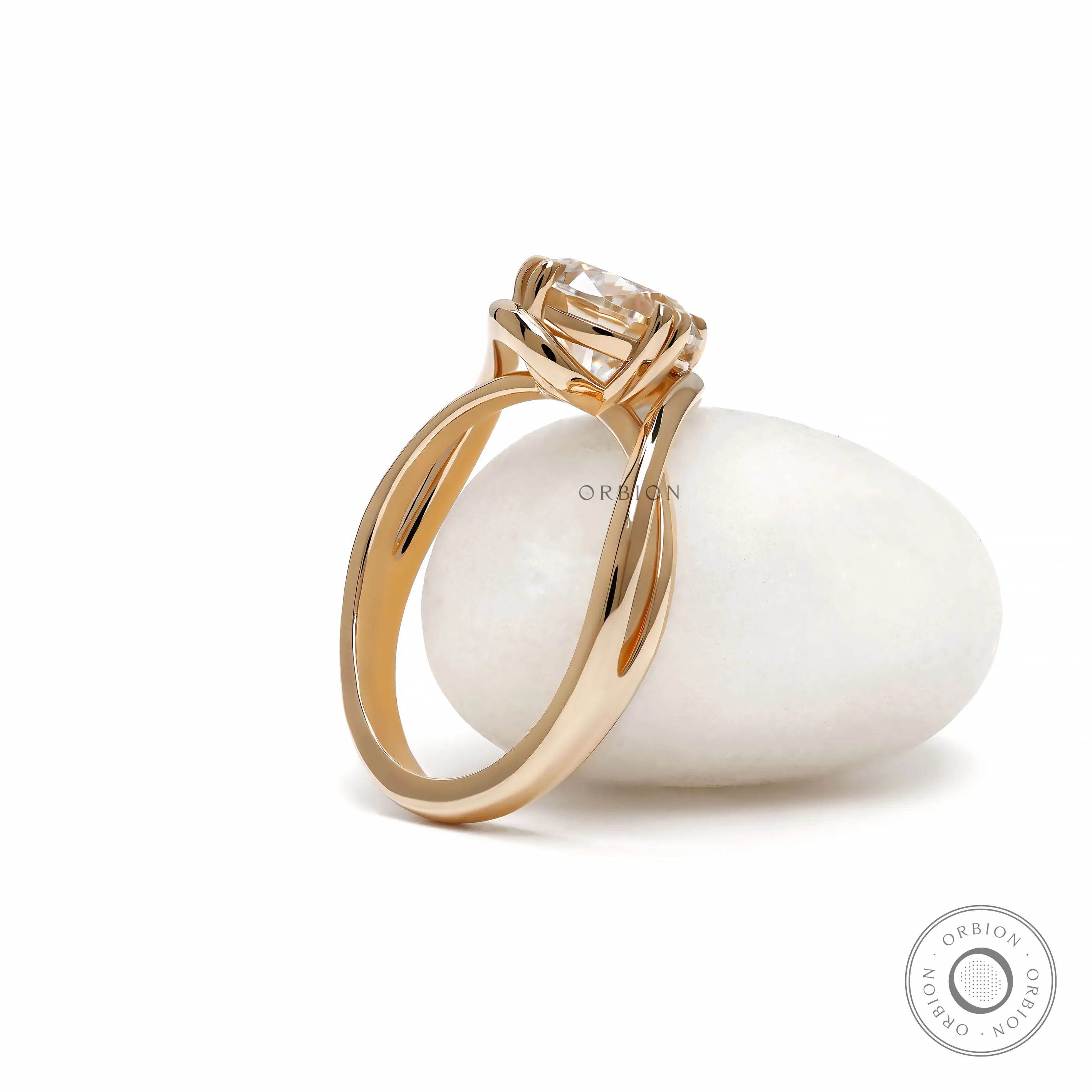Modern crossover moissanite or lab diamond engagement ring in yellow gold with swirl solitaire setting 