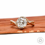 Crossover bypass round cut moissanite engagement ring with compass setting in 14k yellow gold 