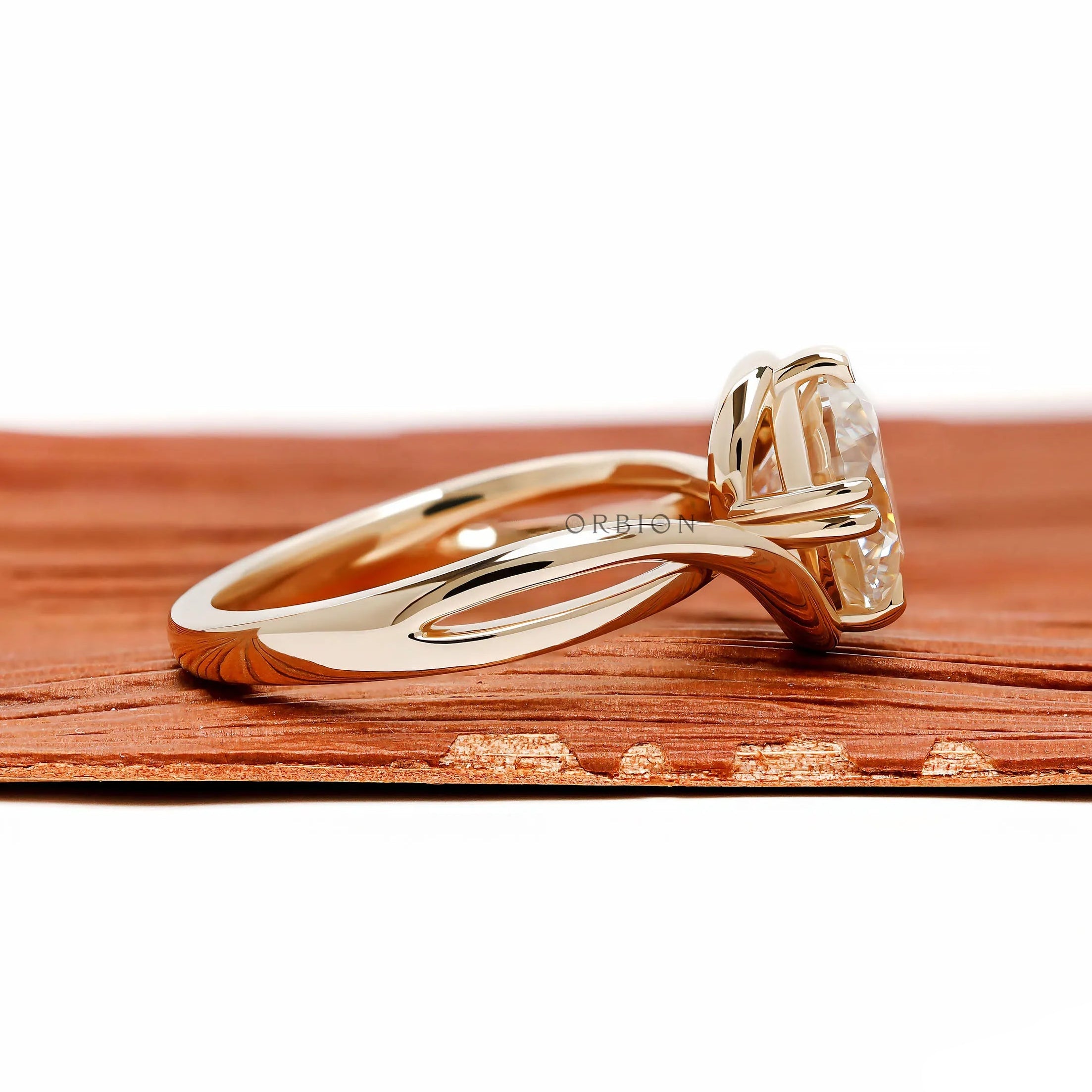 Elegant bypass engagement ring with round moissanite center stone, compass setting