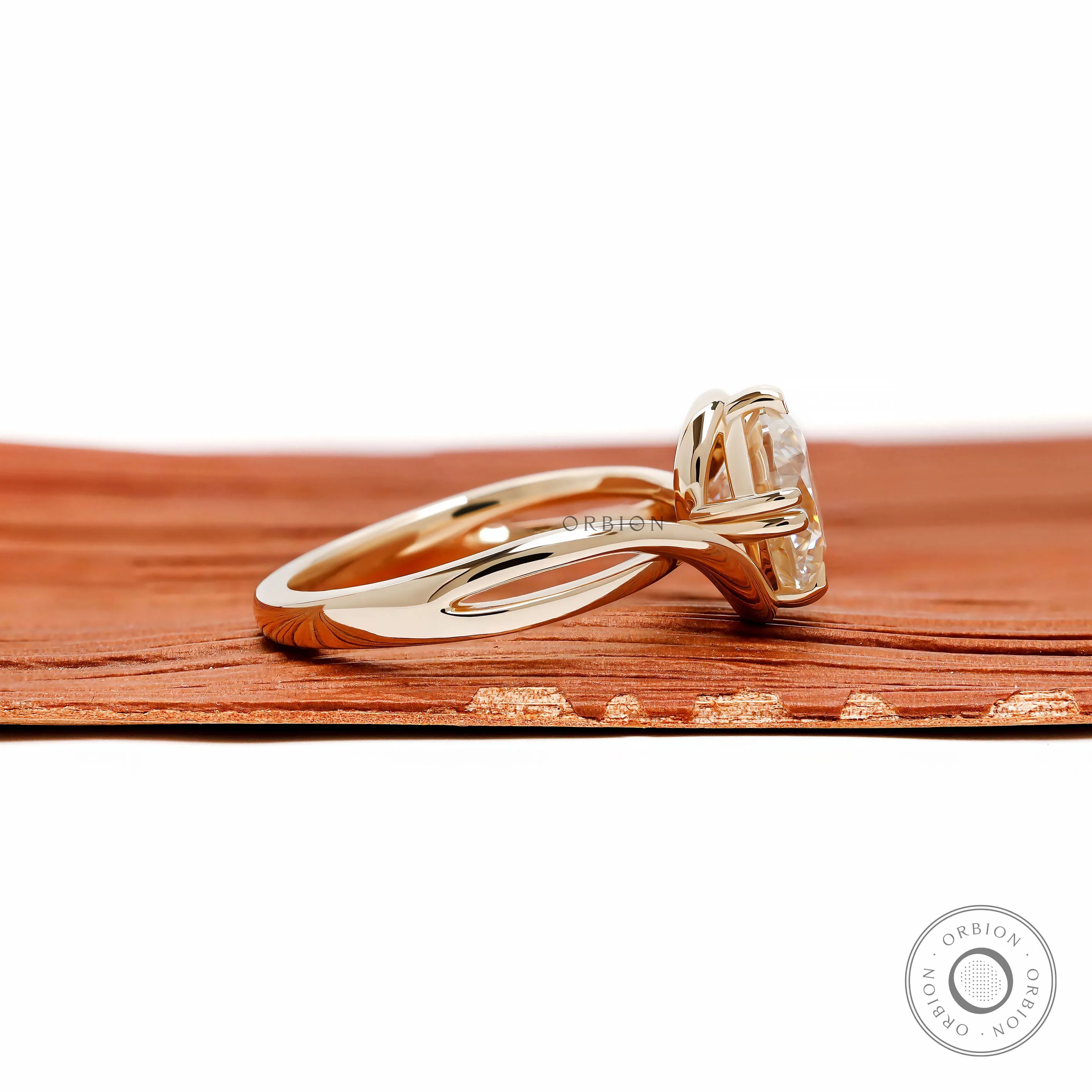 Elegant bypass engagement ring with round moissanite center stone, compass setting