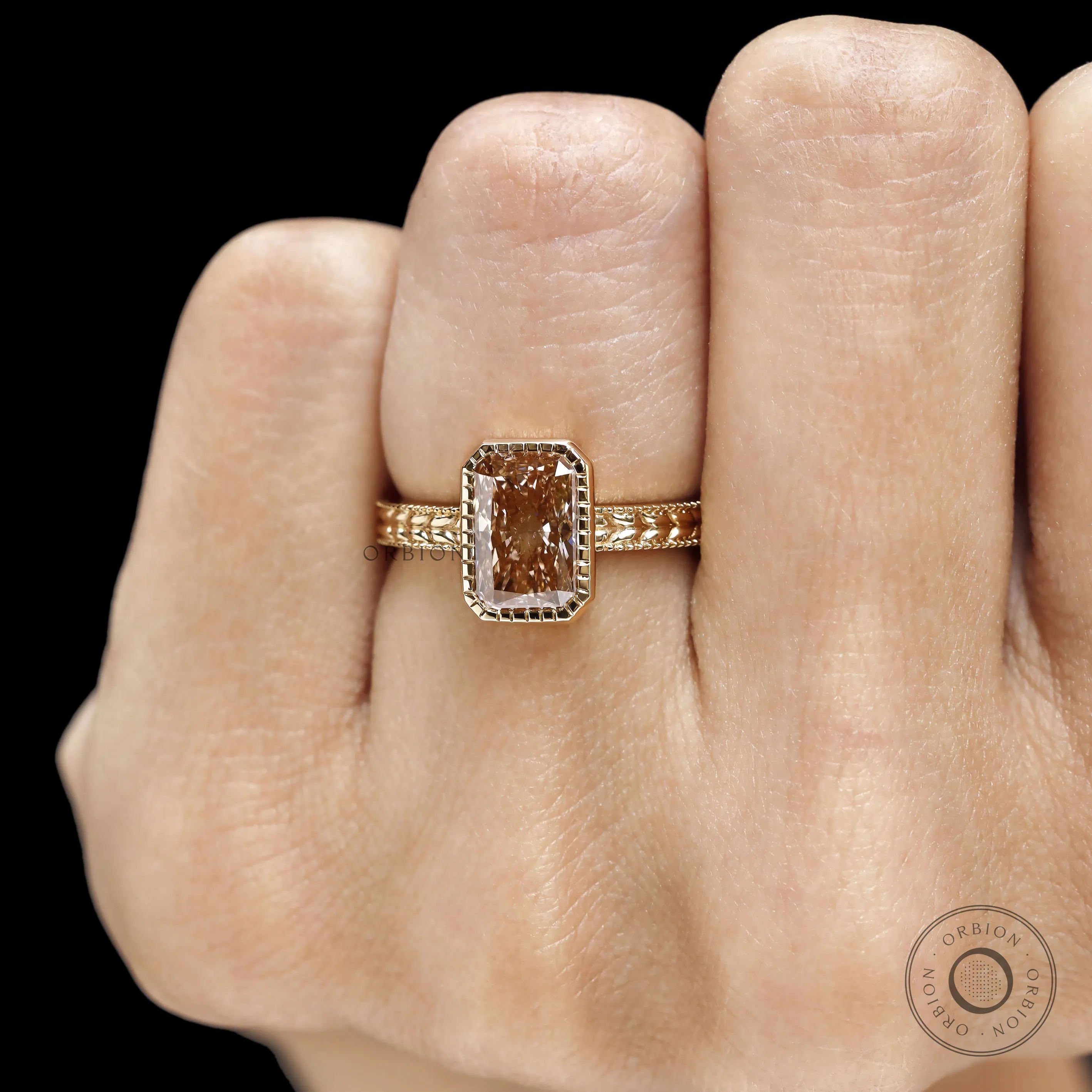 Victorian inspired pink diamond bridal ring with bezel setting and detailed nature motif in 18k gold