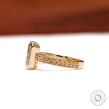 Elegant pink diamond bezel ring for women with antique inspired leaf design and engraved gold band