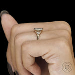 Minimalist wedding ring with emerald cut trilogy stones, bezel setting and 14k yellow gold craftsmanship
