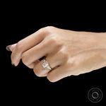 Lab grown diamond emerald cut engagement ring with three stone trilogy setting and clean bezel craftsmanship