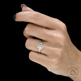 Emerald cut moissanite three stone engagement ring in 14k yellow gold with minimalist bezel wedding band design