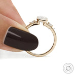 Modern trilogy engagement ring featuring emerald cut lab grown diamonds or moissanite in a sleek 14k gold bezel setting