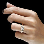 Modern chunky signet ring with half bezel set cushion cut gemstone