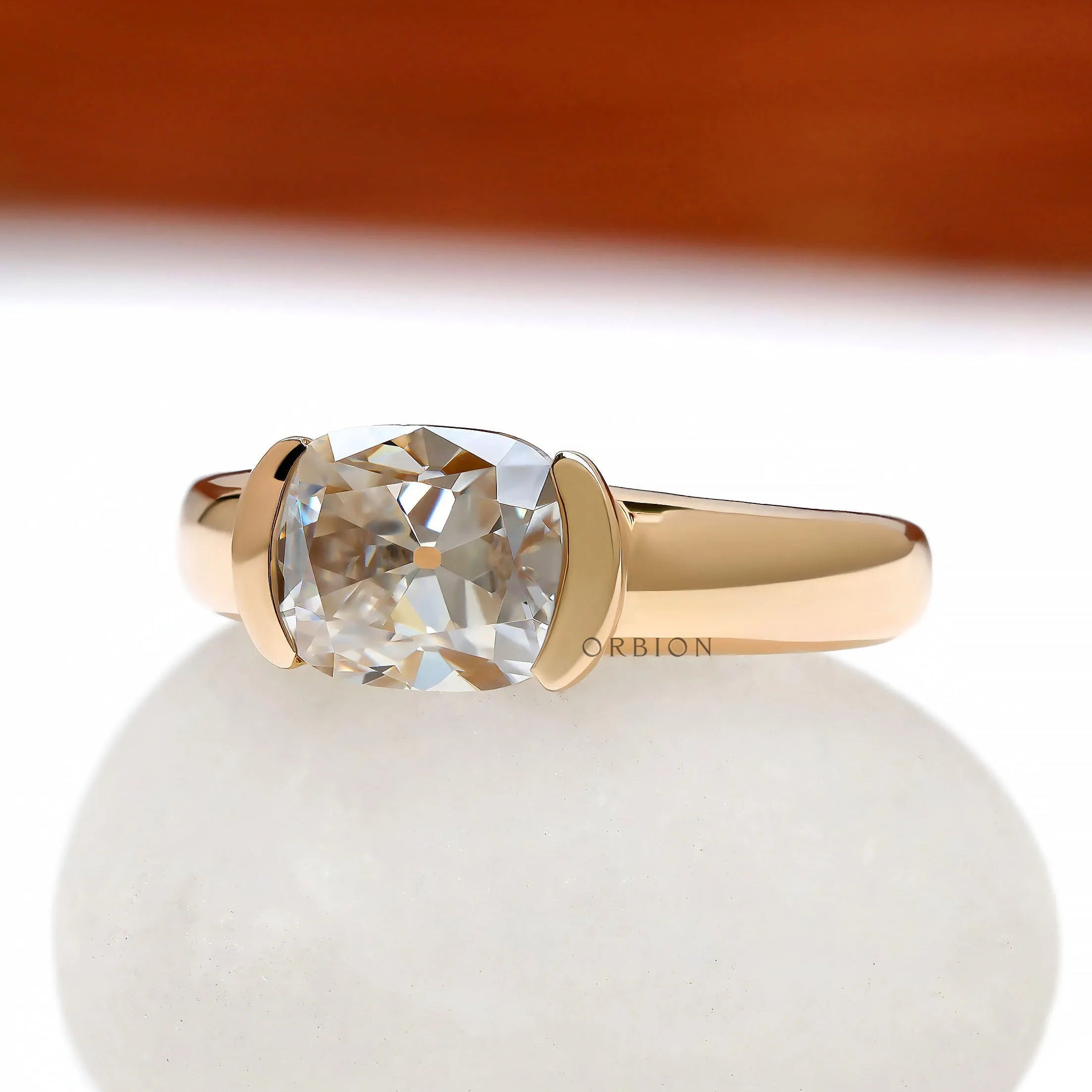 14k yellow gold chunky signet ring featuring east west moissanite
