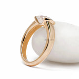 Bold yellow gold signet ring with elongated cushion cut moissanite