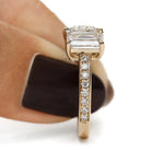 Heart and emerald cut diamond engagement ring in yellow gold