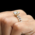 Side profile on-hand view of oval lab diamond ring set showing prong and stacked band