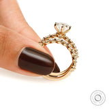 Side standing view of oval lab diamond ring set showing full band structure and shared prong diamonds