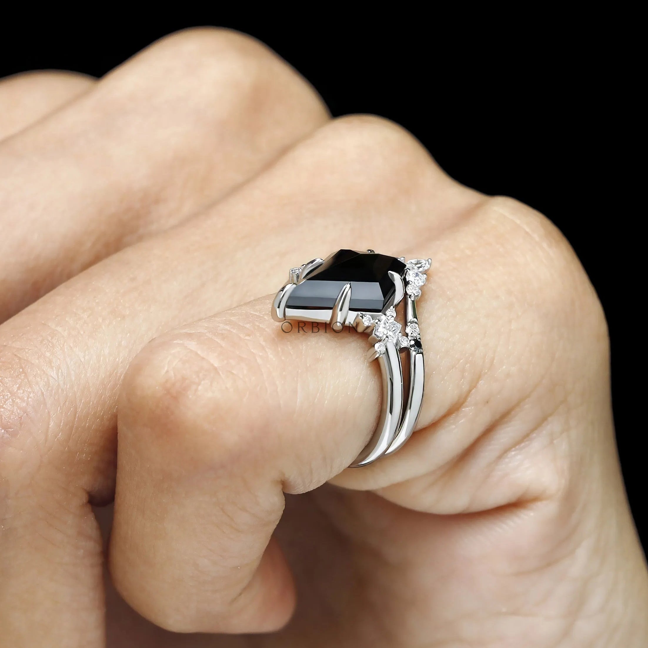 Gothic engagement ring featuring black moissanite solitaire and contour band