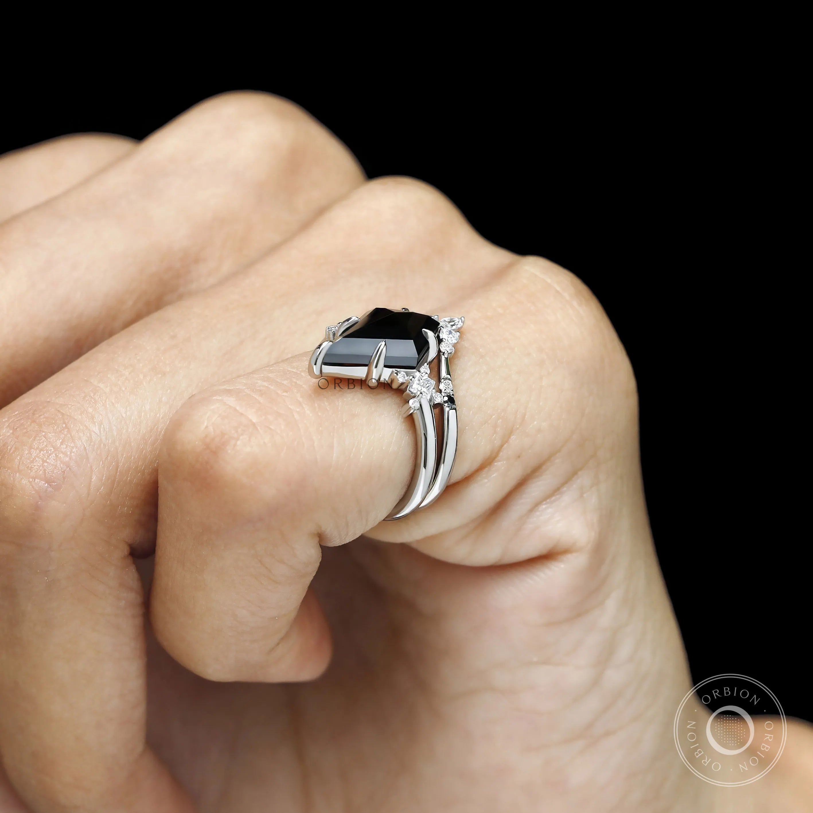 Gothic engagement ring featuring black moissanite solitaire and contour band