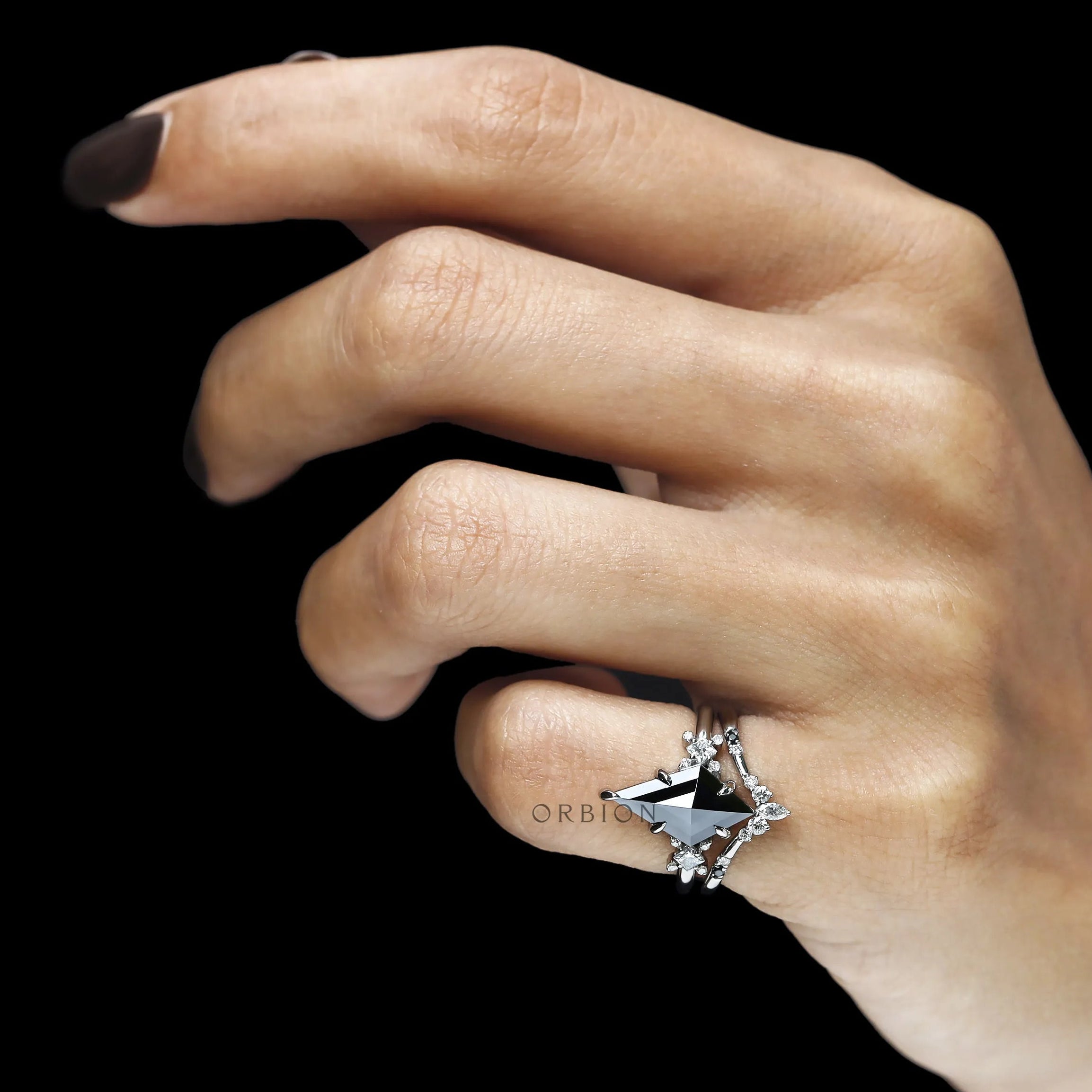 Statement black gemstone bridal ring set with kite cut moissanite and platinum wedding band design