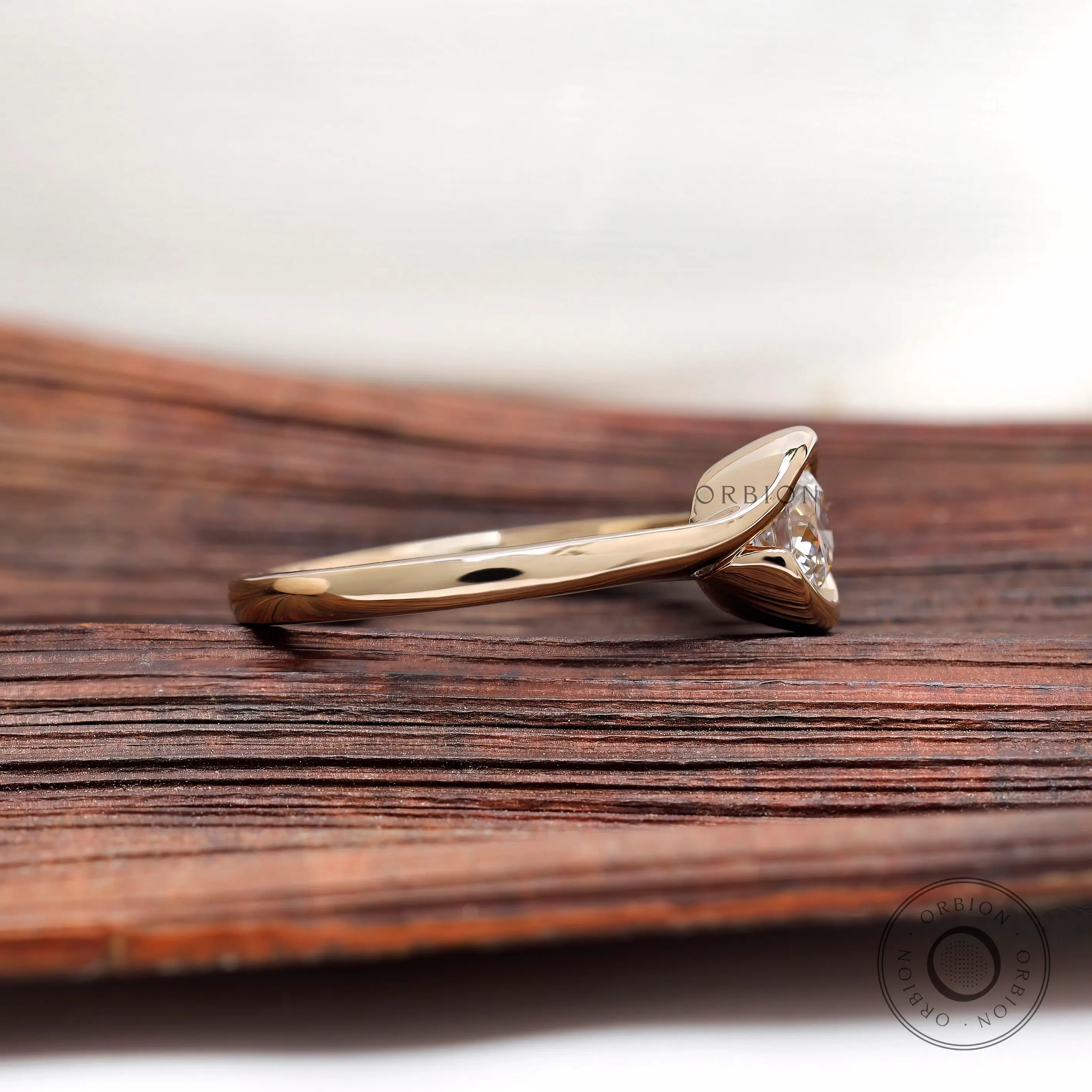 Solitaire diamond ring side profile in yellow gold