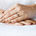 Modern solitaire diamond ring worn on hand