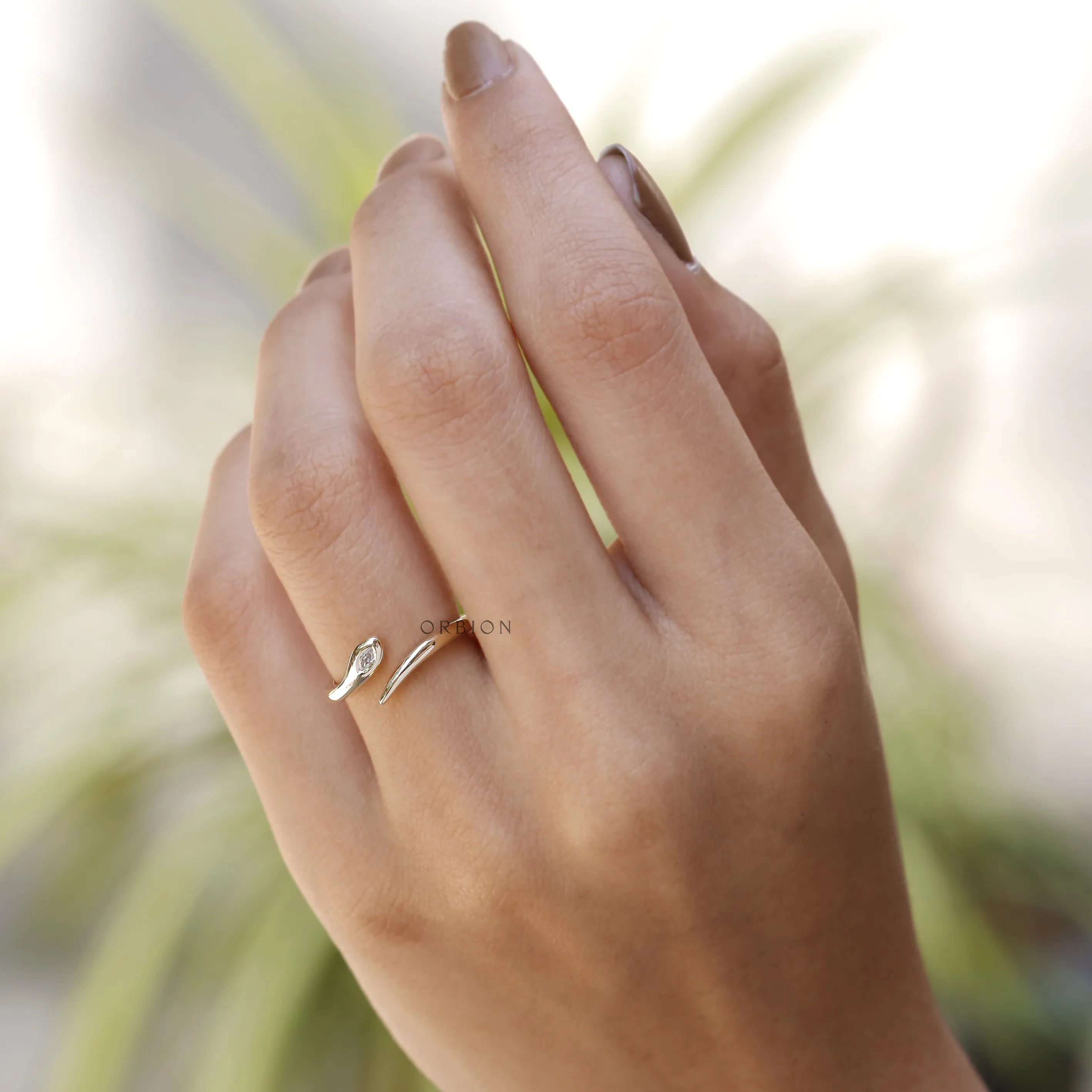 Lightweight minimalist snake ring with flush set lab diamond