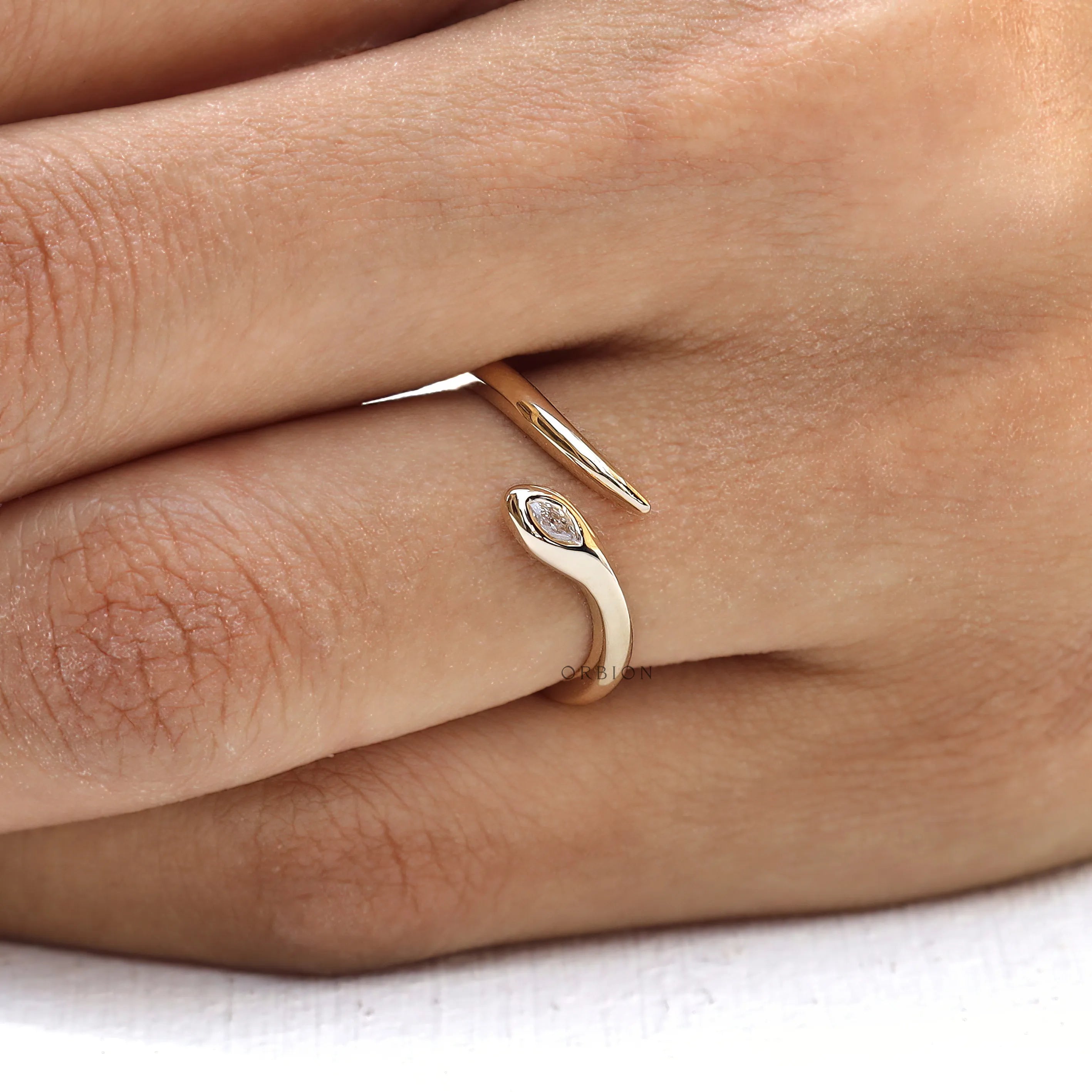 Stackable minimalist snake ring in 14k yellow gold with lab diamond
