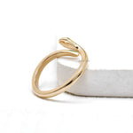 Modern minimalist snake ring in solid 14k yellow gold