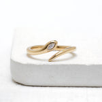 Minimalist snake lab diamond ring in 14k yellow gold with flush set marquise diamond