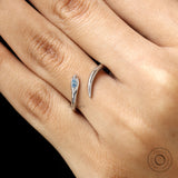 Contemporary lightweight snake ring in 14k white gold with blue diamond