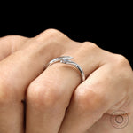 Stackable white gold snake ring with flush set marquise blue diamond
