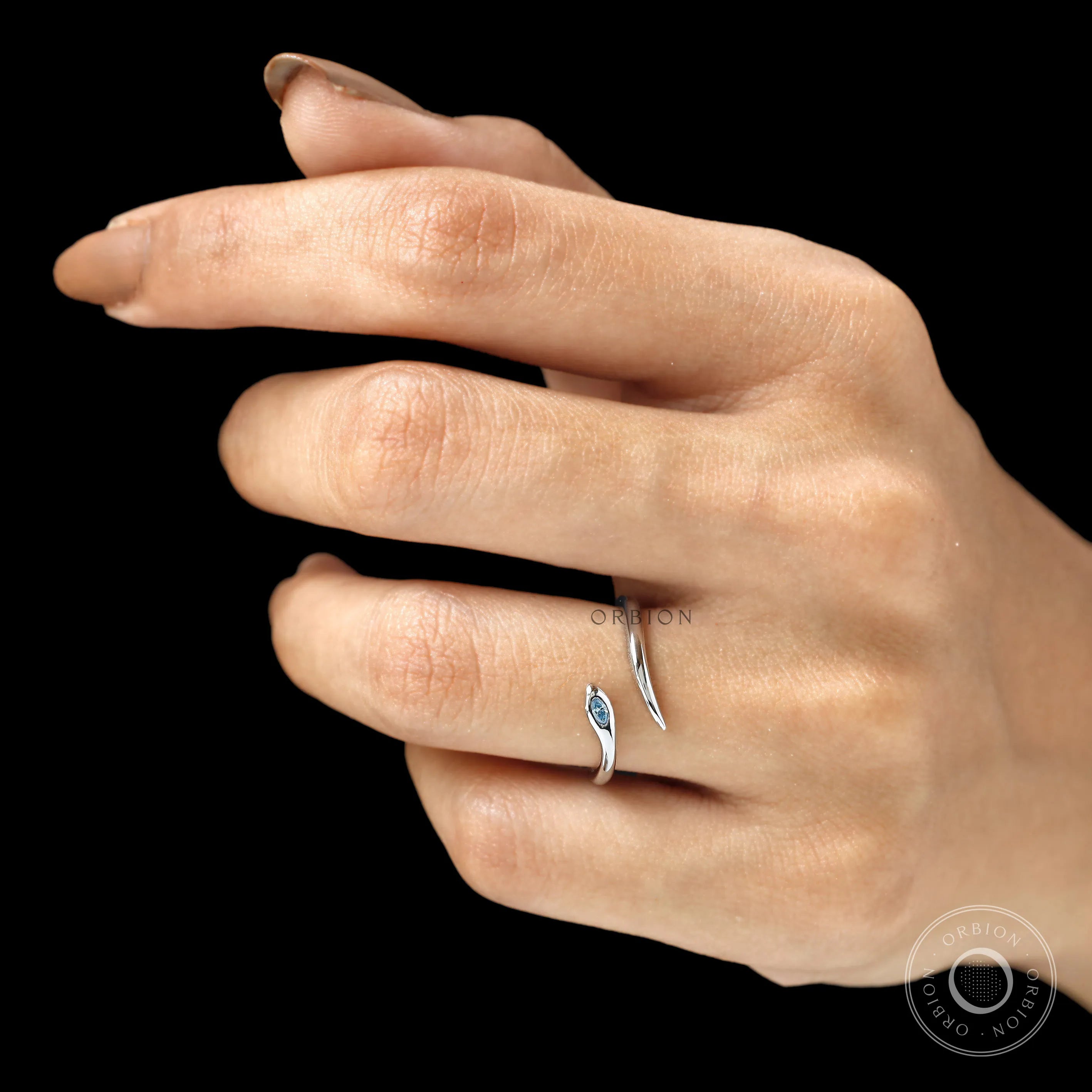 Fine jewelry snake ring with marquise blue diamond in white gold