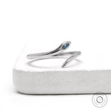 Minimalist snake ring in 14k white gold with marquise blue diamond