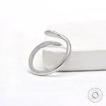 Lightweight 14k white gold snake ring with marquise blue diamond